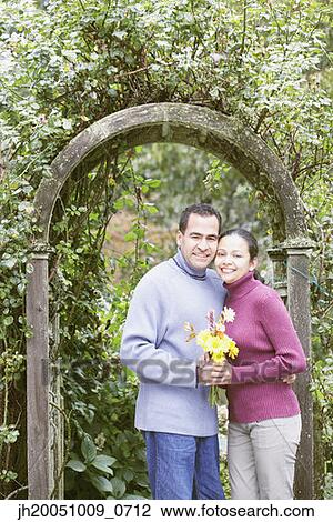 Couple hugging outdoors View Large Photo Image Stock Image - Couple hugging outdoors. Fotosearch