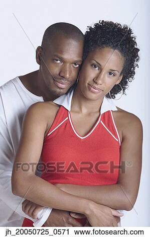 Stock Image - Couple posing for the camera. Fotosearch