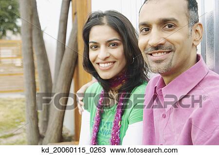 Stock Image - Couple smiling for the camera. Fotosearch