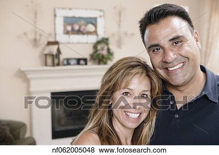 Couple smiling for the camera together View Large Photo Image Stock Photo - Couple smiling for the camera together. Fotosearch
