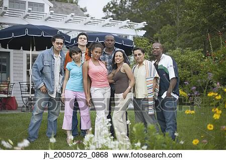 Friends posing for the camera together View Large Photo Image Stock Photo - Friends posing for the camera together. Fotosearch