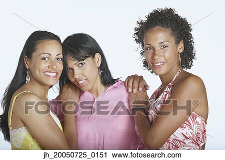 Friends smiling for the camera View Large Photo Image Stock Image - Friends smiling for the camera. Fotosearch