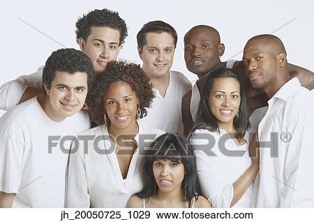 Friends smiling for the camera View Large Photo Image Stock Photo - Friends smiling for the camera. Fotosearch