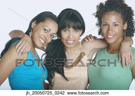 Girlfriends smiling for the camera View Large Photo Image Stock Image - Girlfriends smiling for the camera. Fotosearch