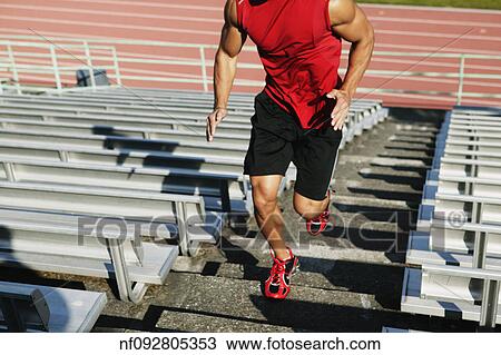 Male athlete running up steps View Large Photo Image Stock Image - Male athlete running up steps. Fotosearch