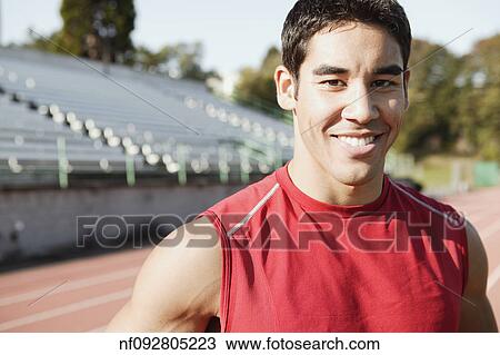 Male athlete smiling for the camera View Large Photo Image Stock Image - Male athlete smiling for the camera. Fotosearch