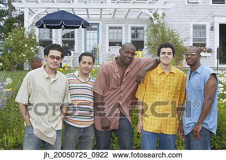 Male friends smiling for the camera View Large Photo Image Stock Image - Male friends smiling for the camera. Fotosearch