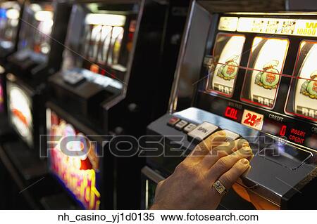 Man pushing the spin button on a slot machine View Large Photo Image Stock Photography - Man pushing the spin button on a slot machine. Fotosearch