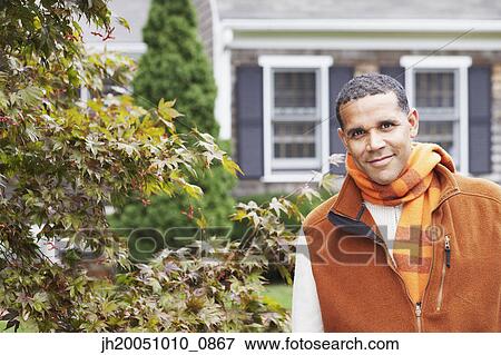Man smiling for the camera outdoors View Large Photo Image Stock Photo - Man smiling for the camera outdoors. Fotosearch