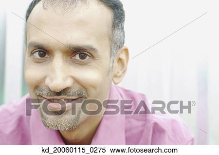 Stock Photography - Man smiling for the camera. Fotosearch