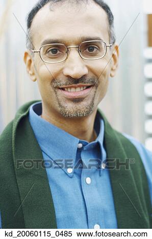 Man smiling for the camera View Large Photo Image Stock Photography - Man smiling for the camera. Fotosearch