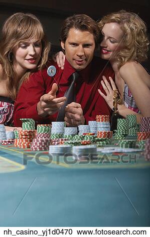 Man successfully gambling in a casino View Large Photo Image Stock Image - Man successfully gambling in a casino. Fotosearch
