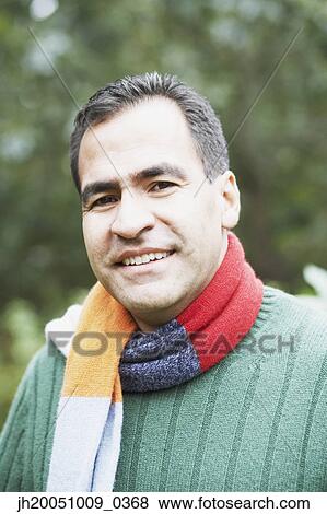 Stock Photo - Man wearing a scarf outdoors. Fotosearch