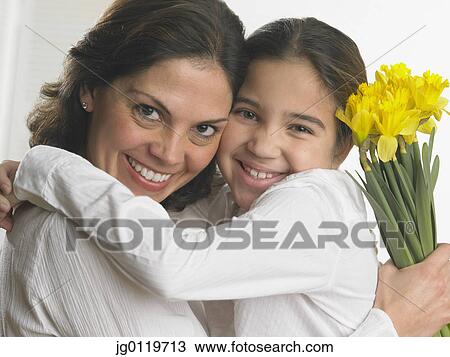 Stock Image - Mother and daughter smiling for the camera. Fotosearch