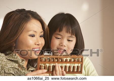 Stock Photography - Mother and daughter using an abacus together. Fotosearch