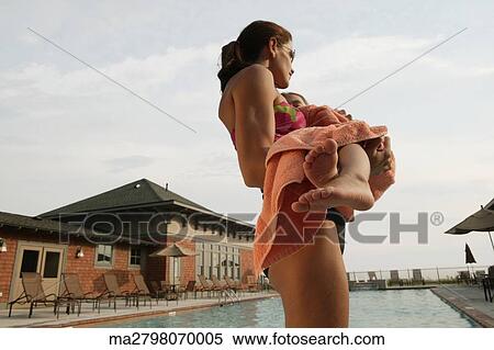 Mother holding her son in a towel View Large Photo Image Stock Photography - Mother holding her son in a towel. Fotosearch