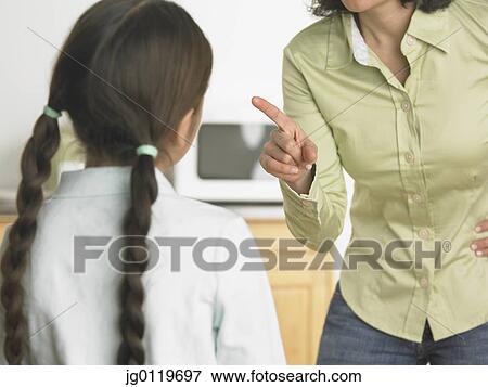Stock Photo - Mother scolding her daughter. Fotosearch