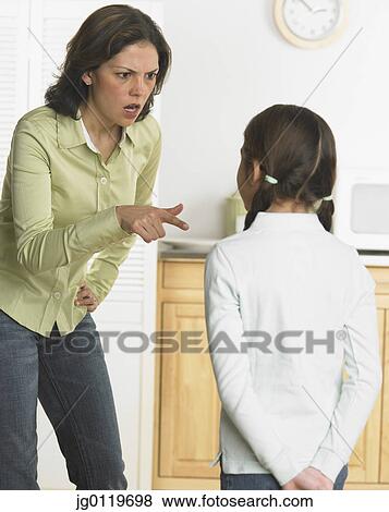 Stock Photo - Mother scolding her daughter. Fotosearch
