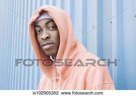 Teenage boy posing for the camera View Large Photo Image Stock Image - Teenage boy posing for the camera. Fotosearch