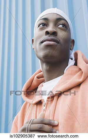 Teenage boy posing for the camera View Large Photo Image Stock Photo - Teenage boy posing for the camera. Fotosearch