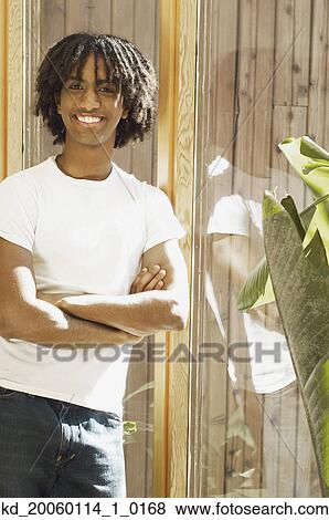Teenage boy smiling for the camera View Large Photo Image Stock Photo - Teenage boy smiling for the camera. Fotosearch