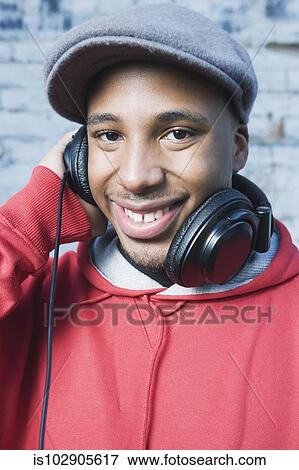 Teenage boy wearing headphones View Large Photo Image Stock Photo - Teenage boy wearing headphones. Fotosearch