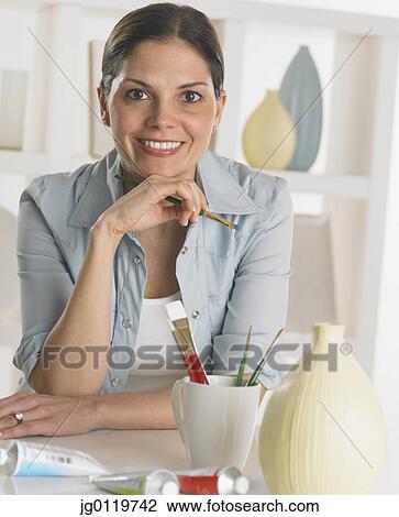 Stock Image - Woman smiling for the camera. Fotosearch
