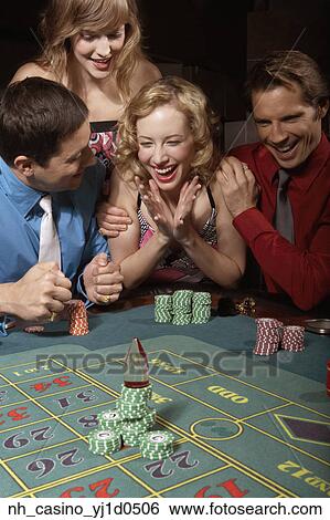 Stock Photograph - Woman successfully gambling in a casino. Fotosearch