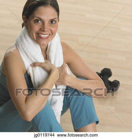 Picture - Woman with a towel around her neck. Fotosearch