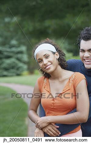Stock Image - Young couple hugging. Fotosearch
