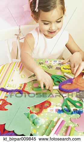 Young girl doing arts and crafts View Large Photo Image Stock Photography - Young girl doing arts and crafts. Fotosearch