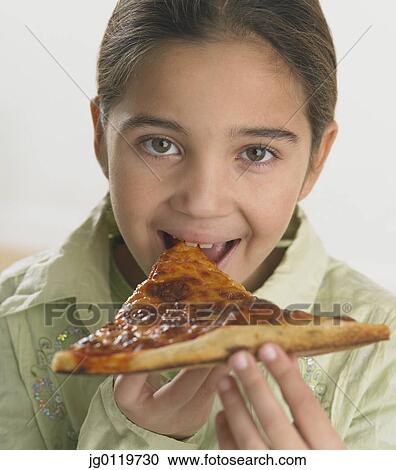 Young girl eating pizza View Large Photo Image Stock Image - Young girl eating pizza. Fotosearch