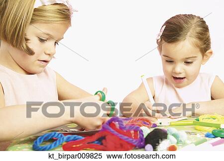Young girls doing arts and crafts View Large Photo Image Stock Photography - Young girls doing arts and crafts. Fotosearch