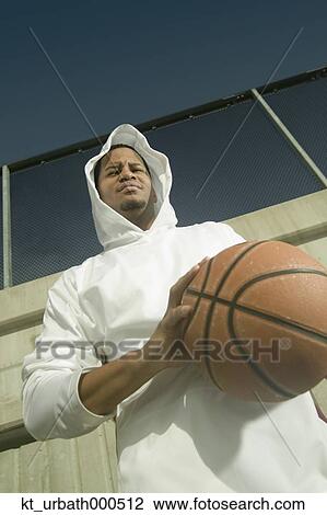 Young man bouncing a basketball View Large Photo Image Stock Image - Young man bouncing a basketball. Fotosearch