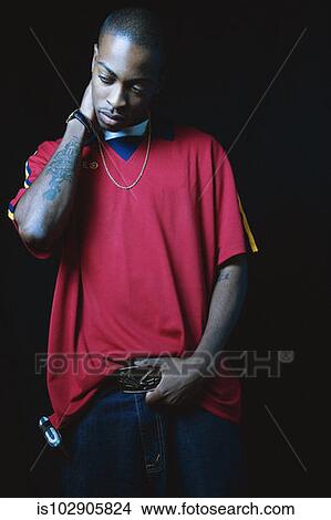 Picture - Young man posing for the camera. Fotosearch