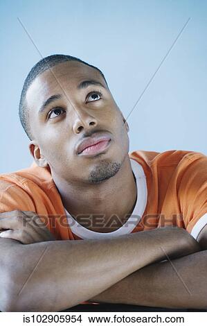Picture - Young man posing for the camera. Fotosearch
