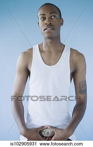 Stock Image - Young man posing for the camera. Fotosearch