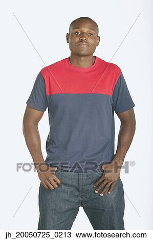 Young man posing for the camera View Large Photo Image Stock Image - Young man posing for the camera. Fotosearch