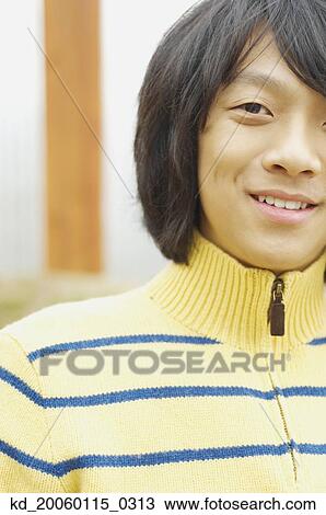 Young man posing for the camera View Large Photo Image Stock Image - Young man posing for the camera. Fotosearch