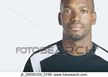 Young man posing for the camera View Large Photo Image Stock Photo - Young man posing for the camera. Fotosearch
