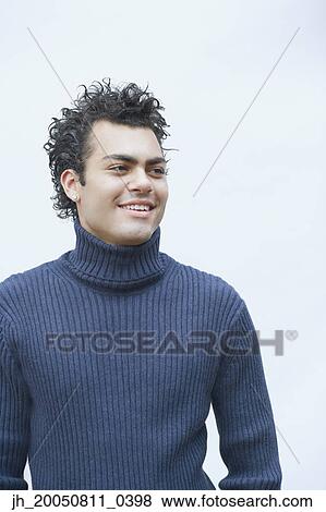 Young man posing for the camera View Large Photo Image Stock Photo - Young man posing for the camera. Fotosearch