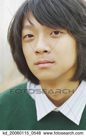 Stock Photo - Young man posing for the camera. Fotosearch