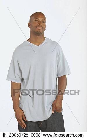 Young man smiling for the camera View Large Photo Image Stock Photo - Young man smiling for the camera. Fotosearch