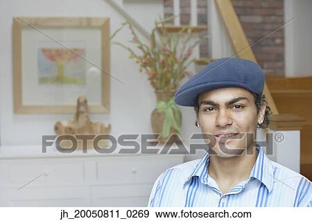 Stock Photo - Young man smiling for the camera. Fotosearch