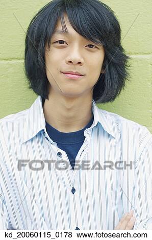 Stock Photo - Young man smiling for the camera. Fotosearch