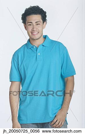 Young man smiling for the camera View Large Photo Image Stock Photograph - Young man smiling for the camera. Fotosearch