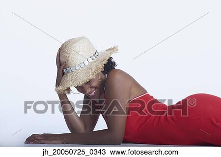 Stock Image - Young woman posing for the camera. Fotosearch