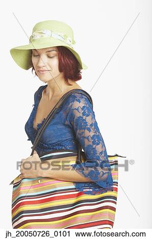 Young woman posing for the camera View Large Photo Image Stock Image - Young woman posing for the camera. Fotosearch