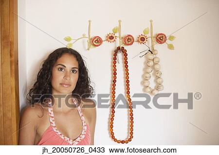 Young woman posing for the camera View Large Photo Image Stock Image - Young woman posing for the camera. Fotosearch