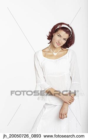 Young woman posing for the camera View Large Photo Image Stock Image - Young woman posing for the camera. Fotosearch
